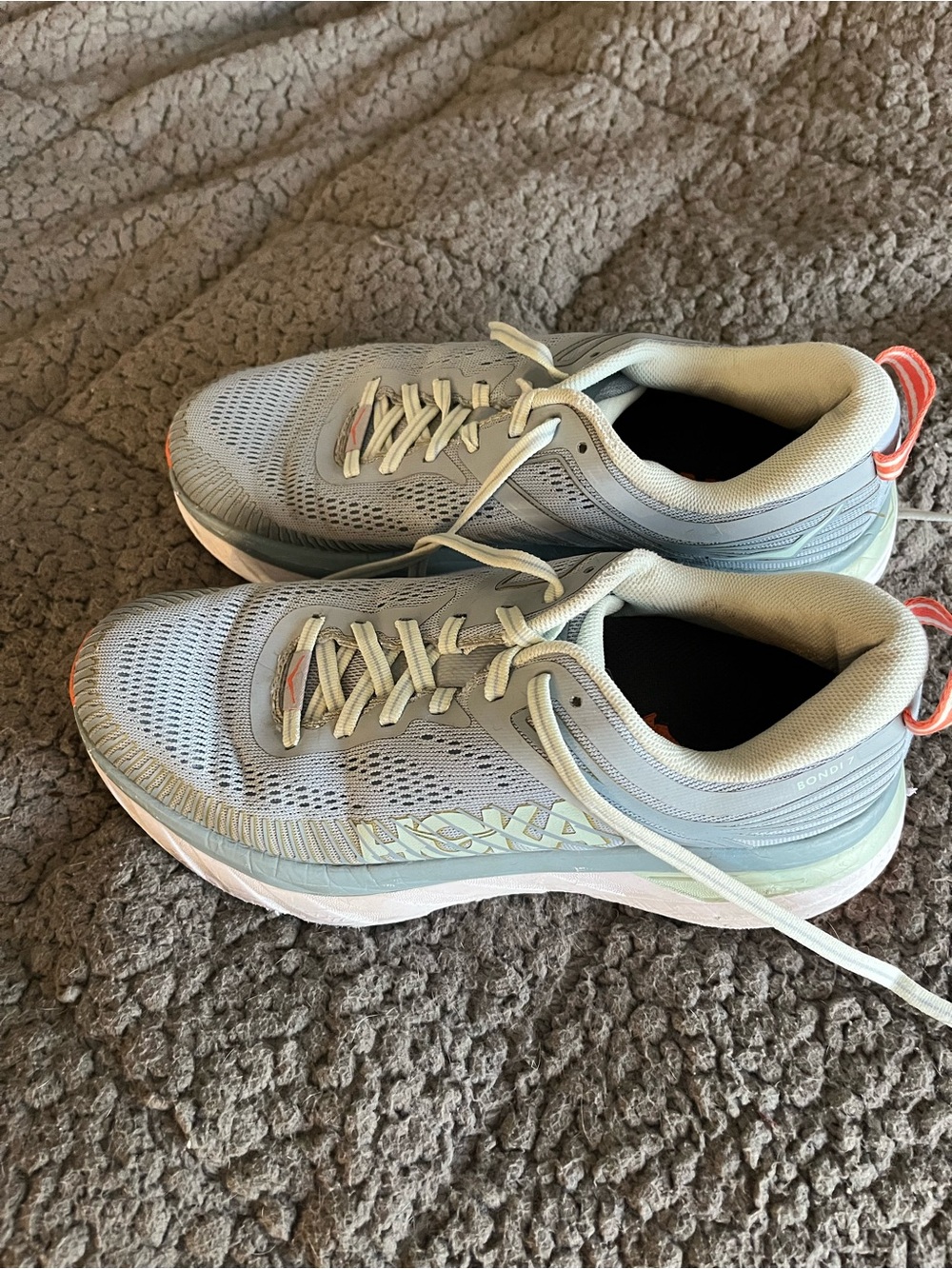 Hoka Women's Light Gray Running Shoes with Coral Pull Tabs